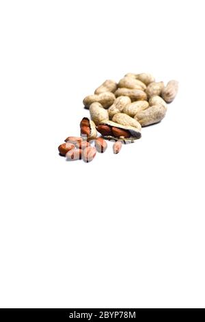 Close up view of shelled peanuts and cracked peanuts isolated on white background Stock Photo