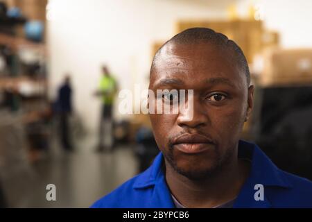 Portrait of disabled worker crafting wheelchairs Stock Photo