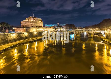 The night view of the castle and bridge of Sant'Angelo in Rome,Italy Stock Photo