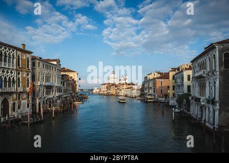 Beautiful view of famous Canal Grande and Basilica di Santa Maria della Salute in daylight, Venice, Italy