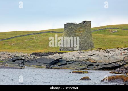 Broch of Mousa;  which is a preserved Iron Age round tower on the rocky coastline. It is on the island of Mousa in Shetland, Scotland. Stock Photo