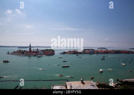 Islands of San Giorgio Maggiore, Giudecca and San Lazzaro degli Armeni. Heavy ship, boat and Vaporetto traffic in Venetian Lagoon as seen from St. Mar Stock Photo