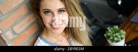 Smiling happy beautiful woman looking at camera Stock Photo