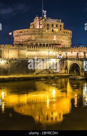 The night view of the castle and bridge of Sant'Angelo in Rome,Italy Stock Photo