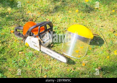 Stihl Chain Saw and Protection Helmet on Grass Stock Photo - Alamy