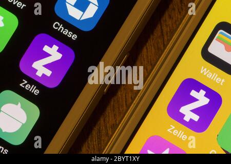 Zelle mobile app icons are seen on smartphones. Zelle is a digital payments network owned by Early Warning Services. Stock Photo