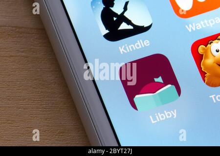 Libby app icon is seen on an iPhone. Libby, built by OverDrive, is a free app where users can borrow ebooks & digital audiobooks from public libraries. Stock Photo