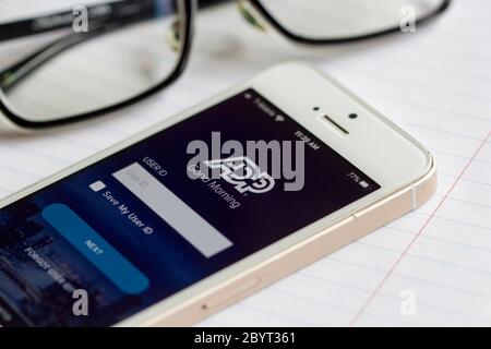 ADP app login screen is seen on an iPhone. Automatic Data Processing Inc. is an American provider of human resources management software and services. Stock Photo