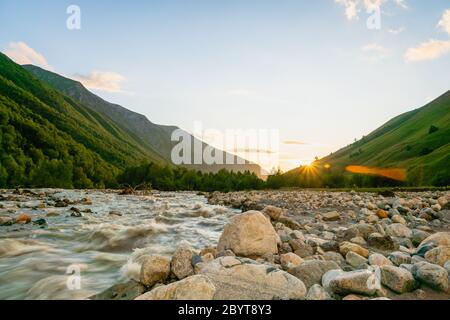 Svaneti landscape at sunset with mountains and river on the trekking and hiking route near Mestia village in Svaneti region, Georgia. Stock Photo