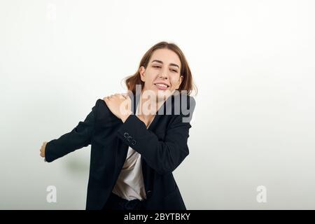 Holds the shoulder hurts, pain in my arm, sore point, problem with health care Stock Photo