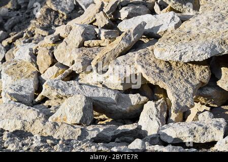 Stack of limestone. big crushed limestone stone. broken sandstone close-up Stock Photo