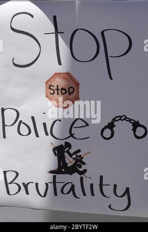 A handwritten sign saying stop police brutality. Stock Photo