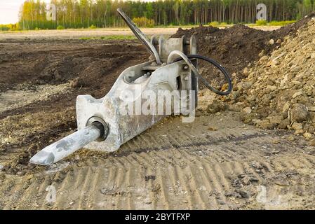 Excavator demolition hammer. excavator hydraulic hammer. hydraulic Jack Hammer used for heavy duty demolition. selective focus. Stock Photo