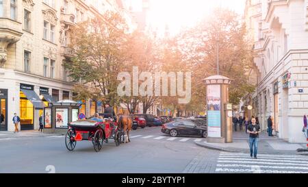 PRAGUE, CZECH REPUBLIC - OCTOBER 17, 2018: Horse carriage tour in Parizska street at Old Town Square in Prague. Tourism in capital city of Czech Republic. Stock Photo