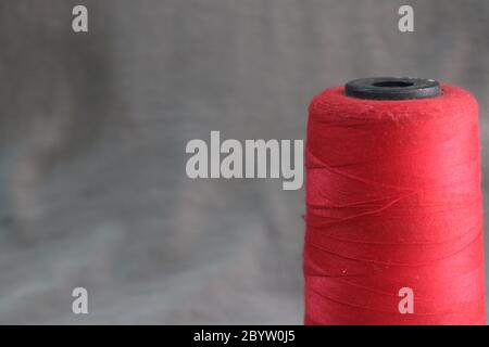 Colorful yarn on spool, yarn on cone, tube, cotton, wool, linen thread Stock Photo