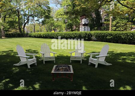 Adirondack chairs on lawn Stony Brook Long Island New York Stock Photo