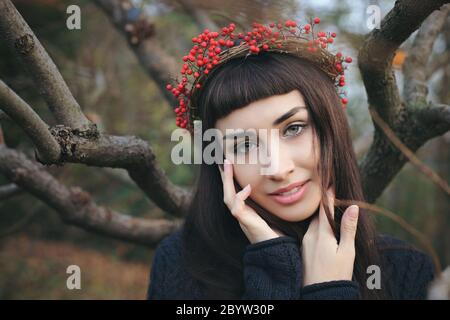 Beautiful woman with sweet smiling expression . Seasonal outdoor portrait Stock Photo