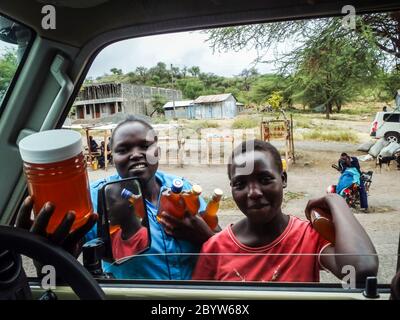 Scenic road leads us to Koriema in Baringo County. As we enter the small town, we are mobbed by women hawking honey Stock Photo