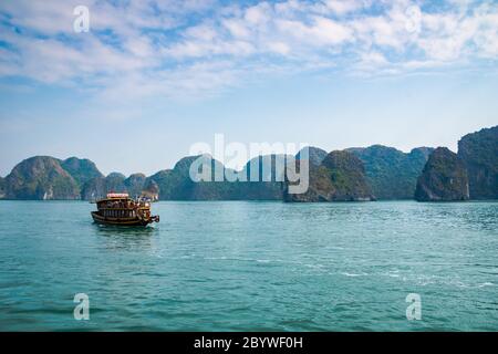 Halong Bay, Vietnam,  with limestone hills. Dramatic landscape of Ha Long bay, a UNESCO world heritage site and a popular tourist destination. Stock Photo