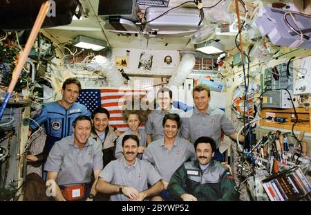 (12-22 Jan. 1997) --- Traditional inflight crew portrait of the combined Mir-22 and STS-81 crews in the Base Block Module aboard Russia's Mir Space Station.  Front row: left to right, Michael A. Baker, commander; John M. Grunsfeld, mission specialist; and cosmonaut Aleksandr Y. Kaleri, Mir-22 flight engineer.  Middle row: cosmonaut Valeri G. Korzun, Mir-22 commander; Marsha S. Ivins, mission specialist; and John E. Blaha, former cosmonaut guest researcher.  Back row: Jerry M. Linenger, cosmonaut guest researcher; Peter J. K. (Jeff) Wisoff, mission specialist; and Brent W. Jett, Jr., pilot.  Li Stock Photo