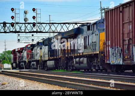 Franklin Park, Illinois, USA. A pair of Canadian Pacific Railway locomotives aided by three off-road units edge a mixed freight train. Stock Photo