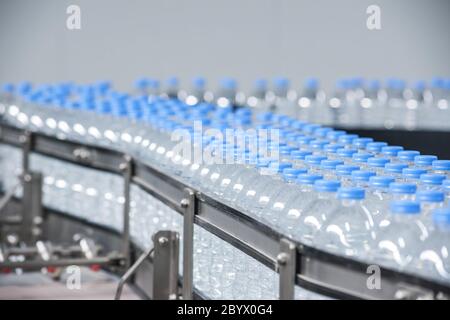 Plastic bottles on conveyor belt Stock Photo