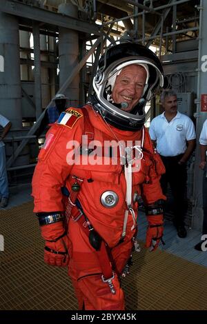 KENNEDY SPACE CENTER,  Fla. -- Dressed in his orange launch and entry spacesuit, STS-86 Mission Specialist Jean-Loup J.M. Chretien of the French Space Agency, CNES, participates in Terminal Countdown Demonstration Test (TCDT) activities at Launch Pad 39A. The first Frenchman to fly in space, Chretien served twice as a research-cosmonaut on Russian missions; STS-86 will be his first flight on the Space Shuttle. STS-86 will be the seventh docking of the Space Shuttle with the Russian Space Station Mir. Liftoff of the Space Shuttle Atlantis on Mission STS-86 is targeted for Sept. 25 Stock Photo