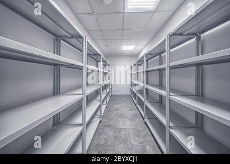 Empty Storage Room warehouse shelves for goods Stock Photo