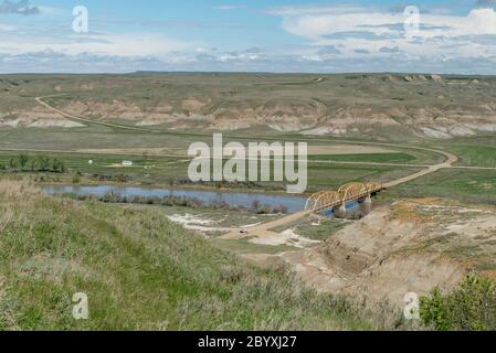 Highway 848 crossing the Red Deer River and Hwy. 570 west of Dorothy. Southeast of Drumheller, Alberta, Canada in springtime. View from the southwest. Stock Photo