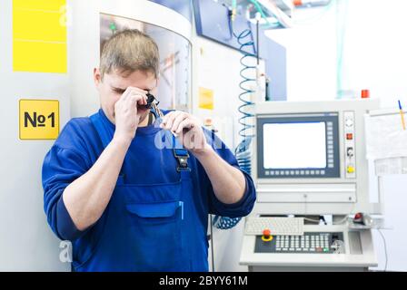 worker measuring detail Stock Photo