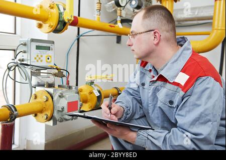heating engineer in boiler room Stock Photo