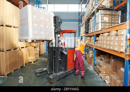 distribution in warehouse with forklift Stock Photo