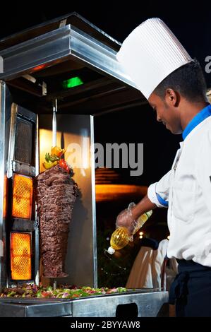 Arab chef making kebab Stock Photo - Alamy