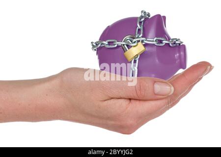 Locked piggy-bank in a hand
