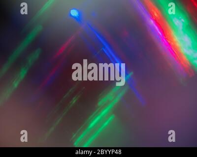 Bright colored lights reflecting off metal and softly focused Stock Photo