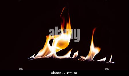 orange flame with reflection on a black background. Stock Photo