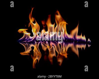 Beautiful flame with reflection on a black background. Stock Photo