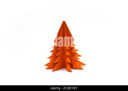 Orange origami christmas tree isolated on white background Stock Photo