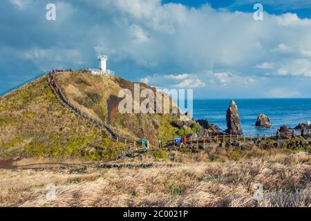 Lighthouse in Seopjikoji Mount Jeju Island , South Korea Stock Photo