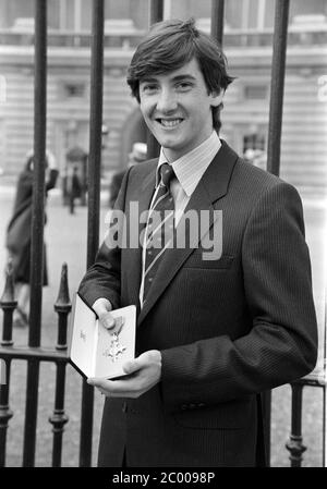 LONDON, UK. Sept 1980: Ice skater Robin Cousins with his O.B.E. (Oreder of the British Empire) medal outside Buckingham Palace. © Paul Smith/Featureflash Stock Photo
