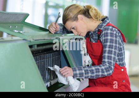 woman fixing cartridge in printer machine at office Stock Photo
