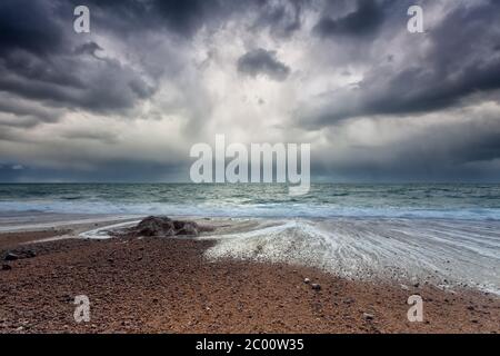 stormy sky over Atlantic ocean coast Stock Photo