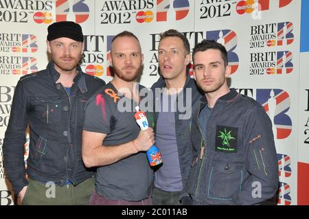 PICTURE QUIZ: Can you identify the missing singer of this well known rock band from the U.K.? ANSWER: Chris Martin of Coldplay  Coldplay The BRIT Awards 2012 at the O2 Arena - Press Room London, England - 21.02.12  Featuring: Coldplay Where: London, United Kingdom When: 21 Feb 2012 Credit: WENN  Where: London, United Kingdom When: 21 Feb 2012 Credit: GCL/ZJE/IconicPix/WENN.com  **Only available for publication in UK, USA, Germany** Stock Photo
