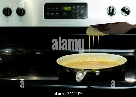 Homemade caramel cooking Process in frying pan. Stock Photo
