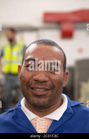 Worker building wheelchairs portrait smiling Stock Photo