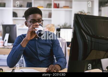 African American businessman portrait working and drinking coffee Stock Photo