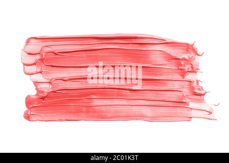 Big Rectangular pink or coral brush strokes or smears isolated on white background. Top view. Mock up with copy space. Pink metallic make-up smear swa Stock Photo