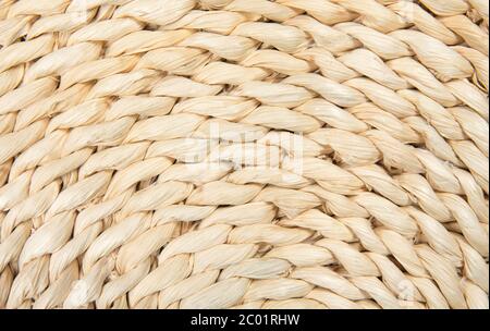 Flat lay view of corn husk braided texture pattern, light beige color. Stock Photo