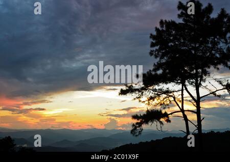 Sunset over high mountain range Stock Photo - Alamy