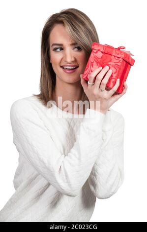 Beautiful Woman Shaking Gift Stock Photo